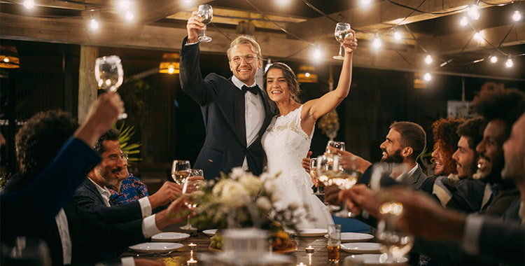 a couple raise their glasses for a wedding toast